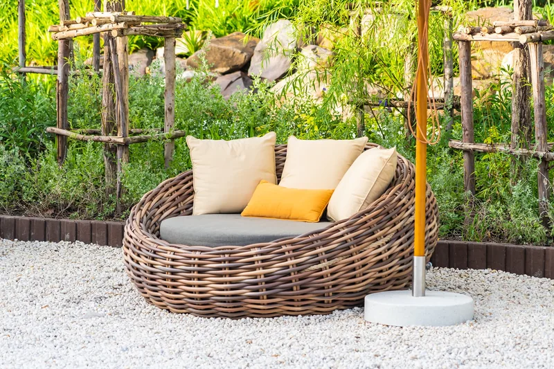 Outdoor garden furniture in a landscaped garden